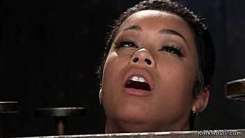 Ebony slave in wooden stock pussy vibed in rough hardcore fetish bdsm black