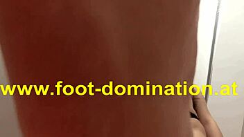 Redhead dominates slave by licking toes and stomping feet