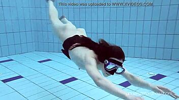 Underwater Slut Roxalana Cheh Strips Naked in Pool Scene