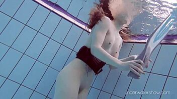 Underwater Slut Roxalana Cheh Strips Naked in Pool Scene