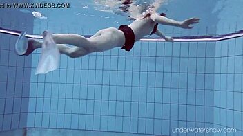 Underwater Slut Roxalana Cheh Strips Naked in Pool Scene