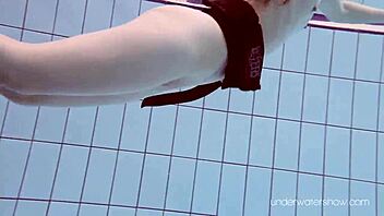 Underwater Slut Roxalana Cheh Strips Naked in Pool Scene