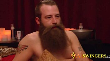 A swinger couple makes a steamy entrance at the mansion's party, engaging in group activities