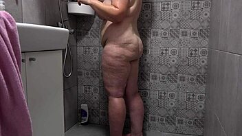 Secretly recorded footage of curvy wife with big tits and fat ass in bathroom