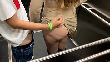 Public sex caught on camera in a risqué elevator encounter