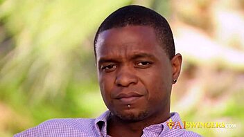 A swinger couple makes a steamy entrance at the mansion's party, engaging in group activities