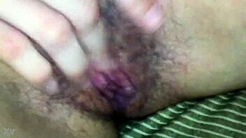Softcore video of a girl giving a handjob on the couch