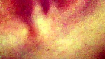Softcore video of a girl giving a handjob on the couch