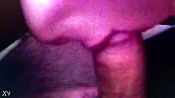 Softcore video of a girl giving a handjob on the couch