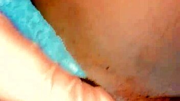 Close-up of a voluptuous ebony woman pleasuring herself