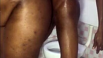 A muscular black man gives a blowjob to a busty woman while he enjoys her tight pussy with his massive cock.