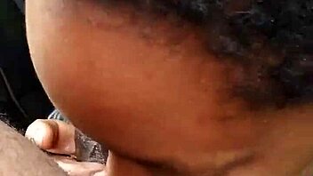 Ebony amateur giving a blowjob outdoors