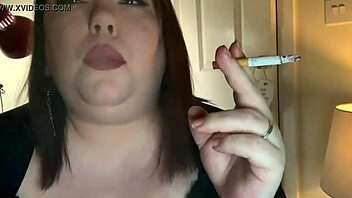 Chubby submissive Tina smokes cigarette under domination