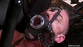 redhead ebony and muscled man in bizarre tied up activity