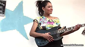 Watch the seductive Santalatina in lingerie as she explores her musical and sexual talents