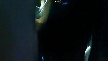 Curvy middle-aged woman displays her assets by the hotel window