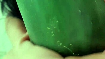 Mature Woman Spreads Legs Wide for Wet Cucumber Masturbation on Hairless Pussy