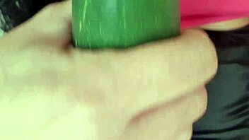 Mature Woman Spreads Legs Wide for Wet Cucumber Masturbation on Hairless Pussy