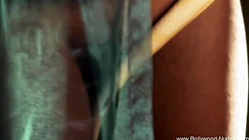 beautiful indian woman performs an arousing dance for the audience