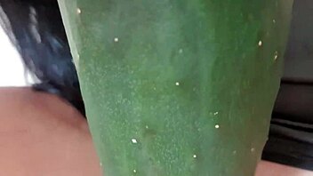 Mature Woman Spreads Legs Wide for Wet Cucumber Masturbation on Hairless Pussy