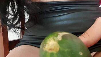 Mature Woman Spreads Legs Wide for Wet Cucumber Masturbation on Hairless Pussy