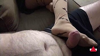 POV video of foot fetishist giving a hard cock a footjob