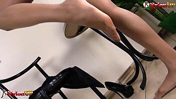 ebony babe in stockings gives footjob and masturbates with dildo