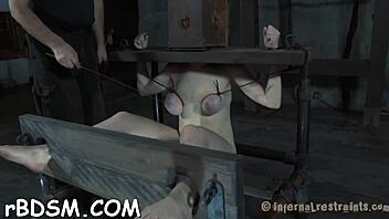 tough girl competes in a challenging game with restraints and gagging