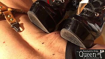 queen dominatrix frida, uh, frickin’ rules with bdsm fetish boots and latex while servant cleans up her mess... dang!