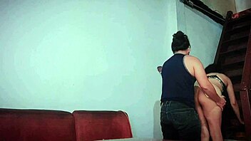 Intense encounter with stepmother on stairs and couch in authentic homemade video
