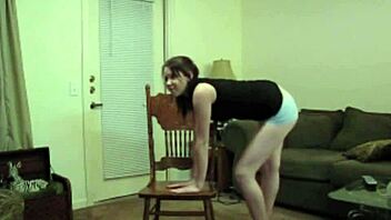 Tiny red slut dances and teases with natural tits