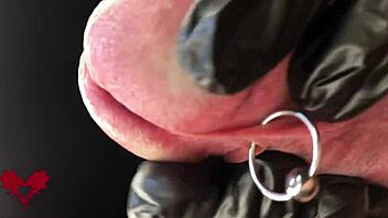 this is close up extreme second side view latex gloves detailled peehole and cumshot