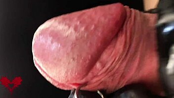 this is close up extreme second side view latex gloves detailled peehole and cumshot