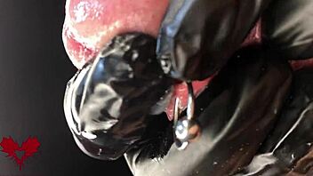 this is close up extreme second side view latex gloves detailled peehole and cumshot