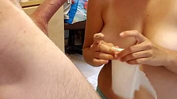 An 18-year-old amateur with large breasts gives oral pleasure to her male friend's erect penis, resulting in a cumshot while wearing panties.