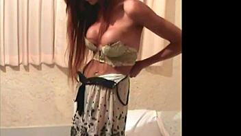 Ladyboy enjoys striptease and shecock jerking