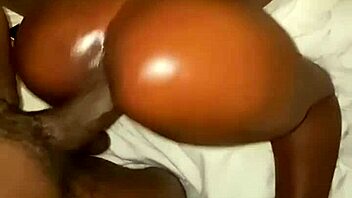 A voluptuous ebony with a curvaceous rear end enjoys doggy-style penetration from a sizable black shaft, featuring close-ups of the action and ass worshiping.