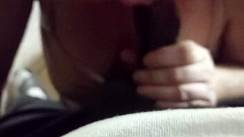 My girlfriend is sucking that big black cock. Sharing with friend in casual setting.