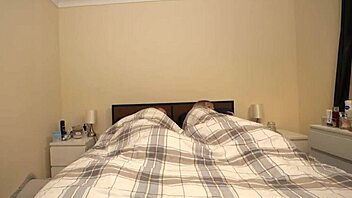 Stepson and stepmother cuddle in bed due to cold weather