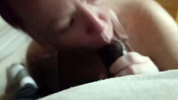 My girlfriend is sucking that big black cock. Sharing with friend in casual setting.