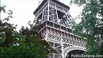 Two well-endowed men pleasure a lovely girl out in the open near the Eiffel Tower in Paris