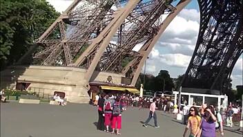 Two well-endowed men pleasure a lovely girl out in the open near the Eiffel Tower in Paris