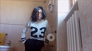 Sneaky cheerleader teases with close-up peeing and farting in hidden bathroom video