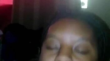 Petite ebony girl gives a sensual blowjob to a muscular bodybuilder while he works out on the bench