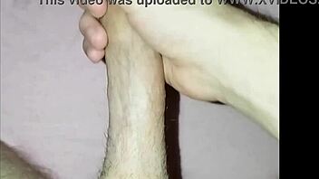 young guy at home massages his cock in solo masturbation session