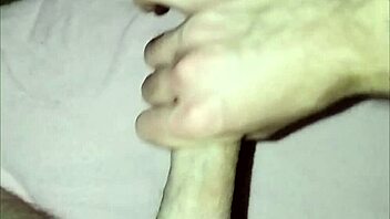 young guy at home massages his cock in solo masturbation session