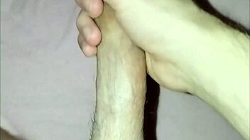 young guy at home massages his cock in solo masturbation session