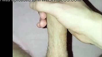 young guy at home massages his cock in solo masturbation session
