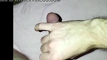 young guy at home massages his cock in solo masturbation session