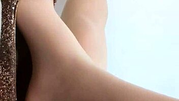 chinese girl teases with feet in stockings